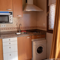 cocina equipada con lavadora vitroceramica y electrodomesticos en llanes